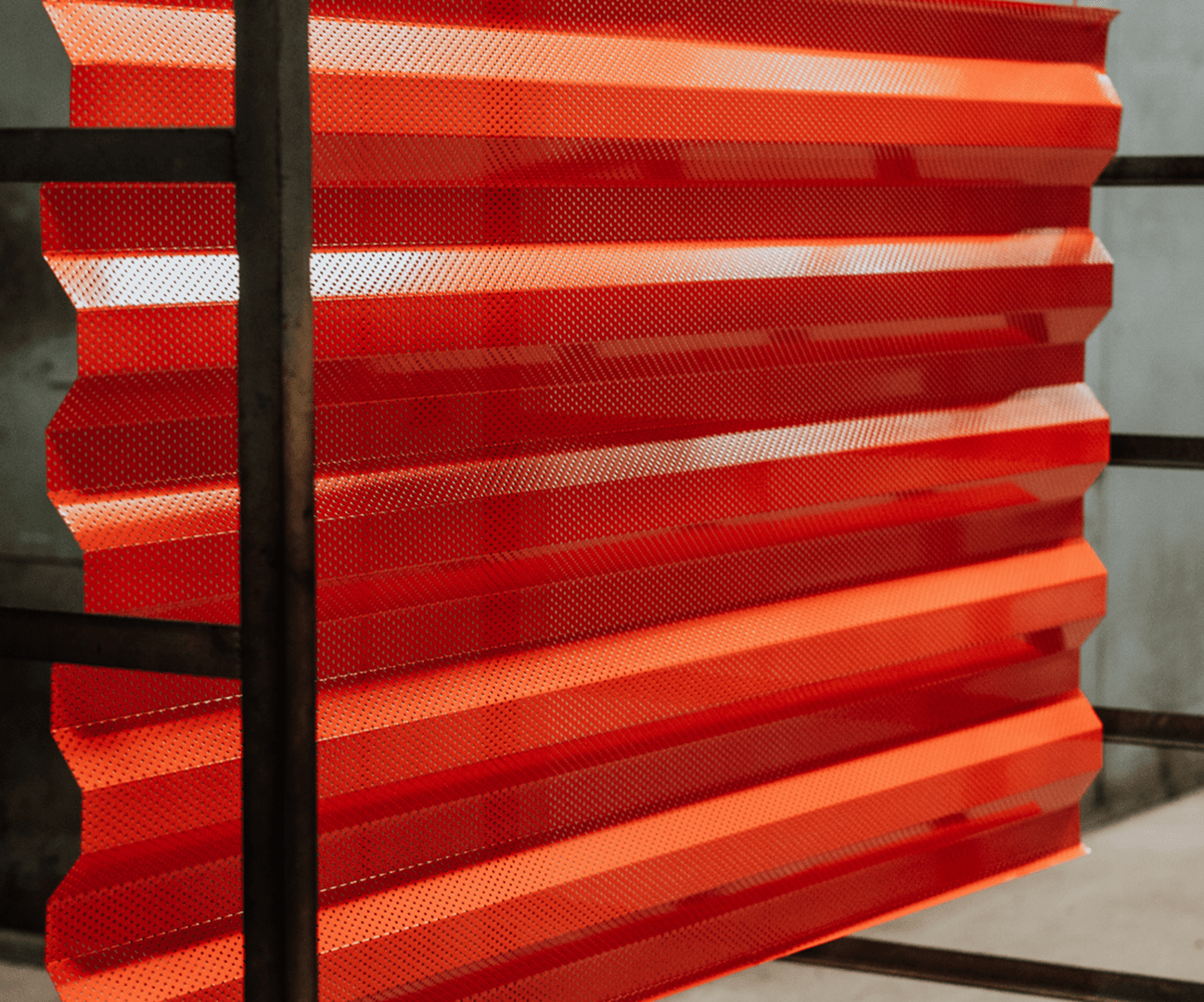 red perforated architectural panel
